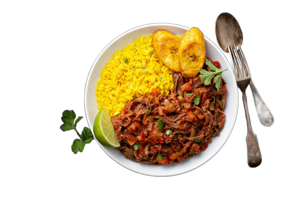 Bowl of ropa vieja with yellow rice and plantains